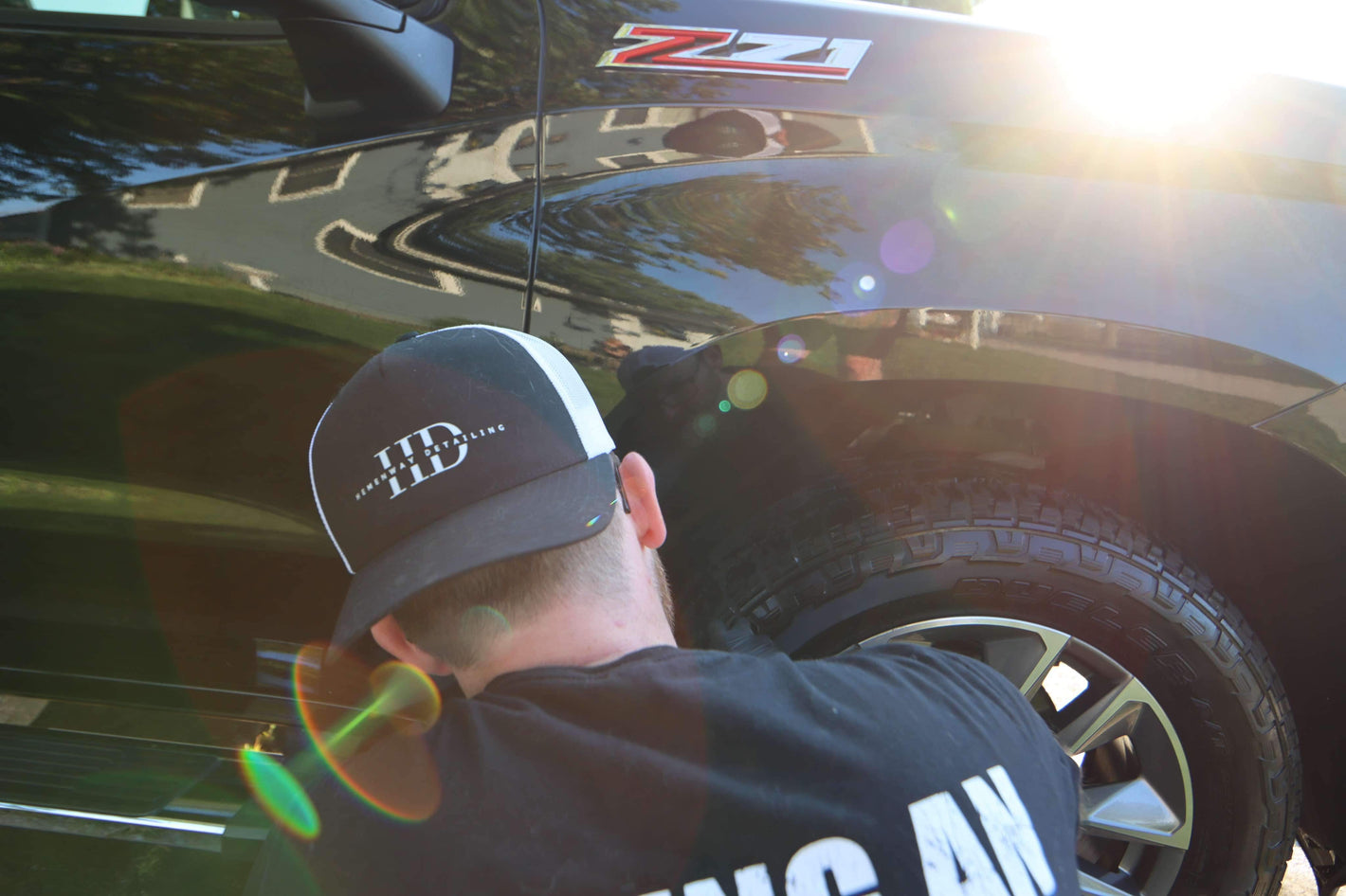 Jacob Hemenway Detailing A Black Truck